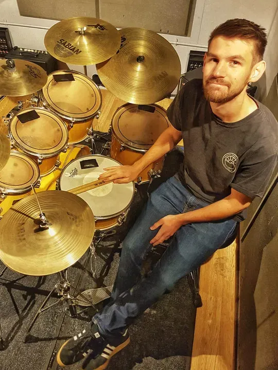 A DeRosa Music tutor with his drum kit
